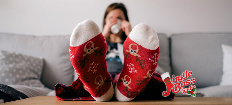 person on couch wearing Christmas socks